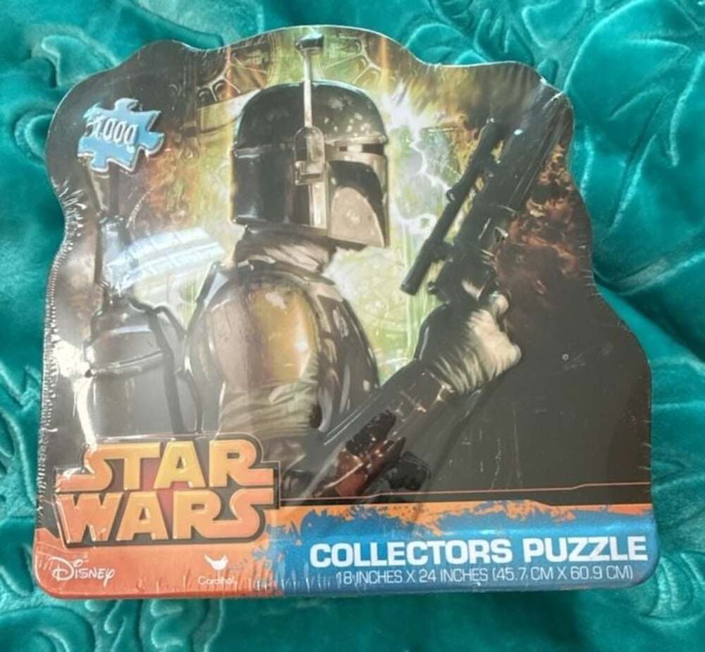 New, unopened package Disney Star Wars Boba Fett 1000 Piece Collector's Tin Jigs